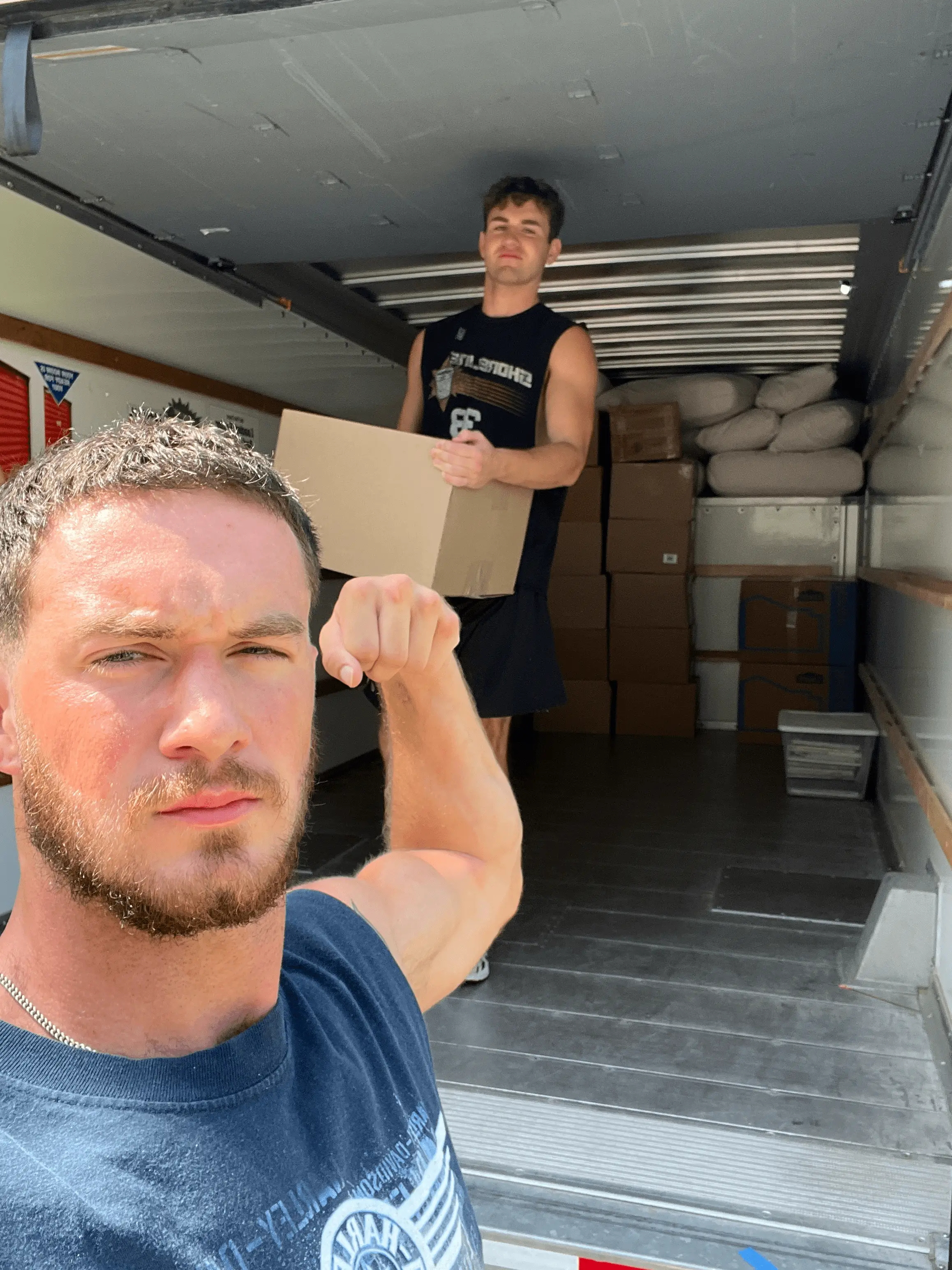 Young Buck Helpers Unloading Truck
