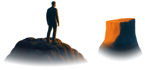 Man standing on mountain looking across a gap to cliff