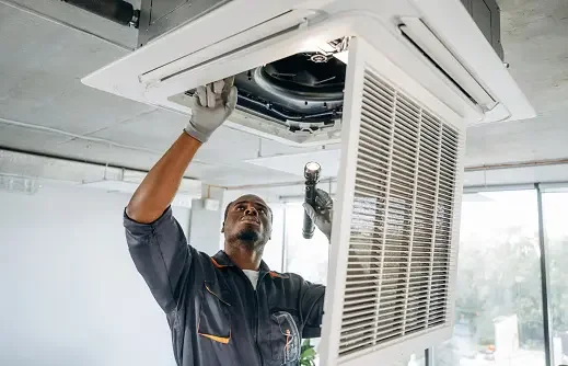 HVAC technician performing a professional Manual J load calculation