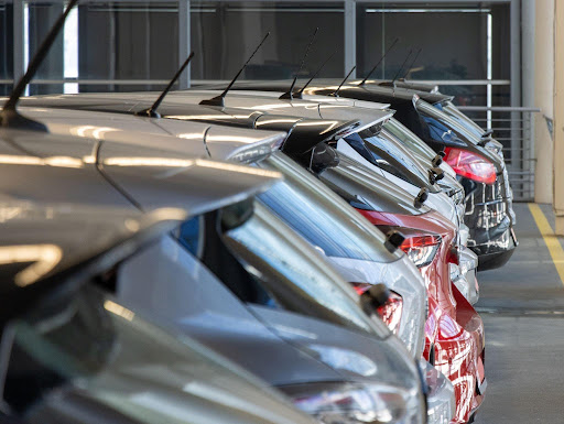 Car dealership inventory on a showroom floor