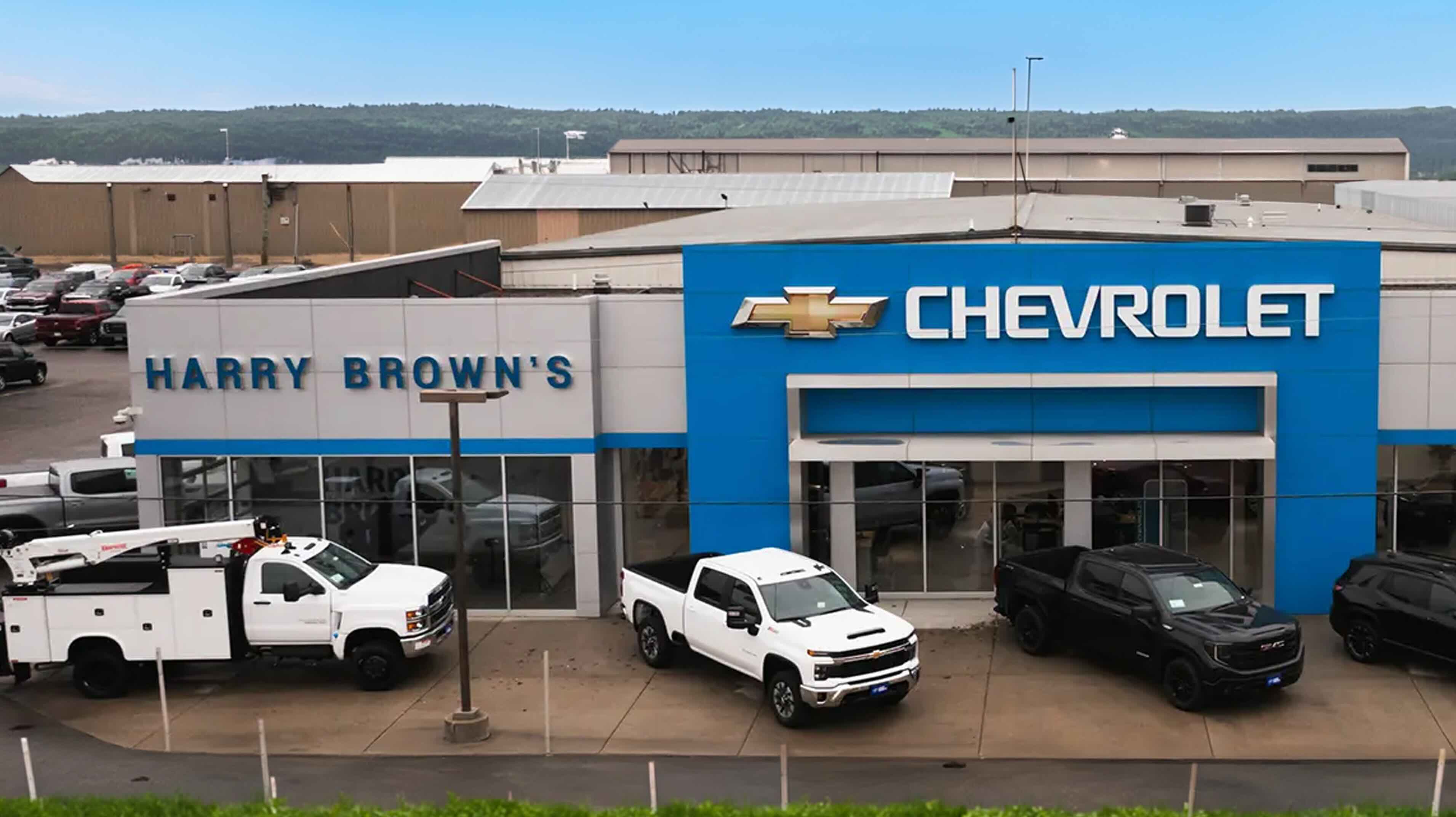 Harry Brown's Chevrolet dealership exterior with trucks on the lot