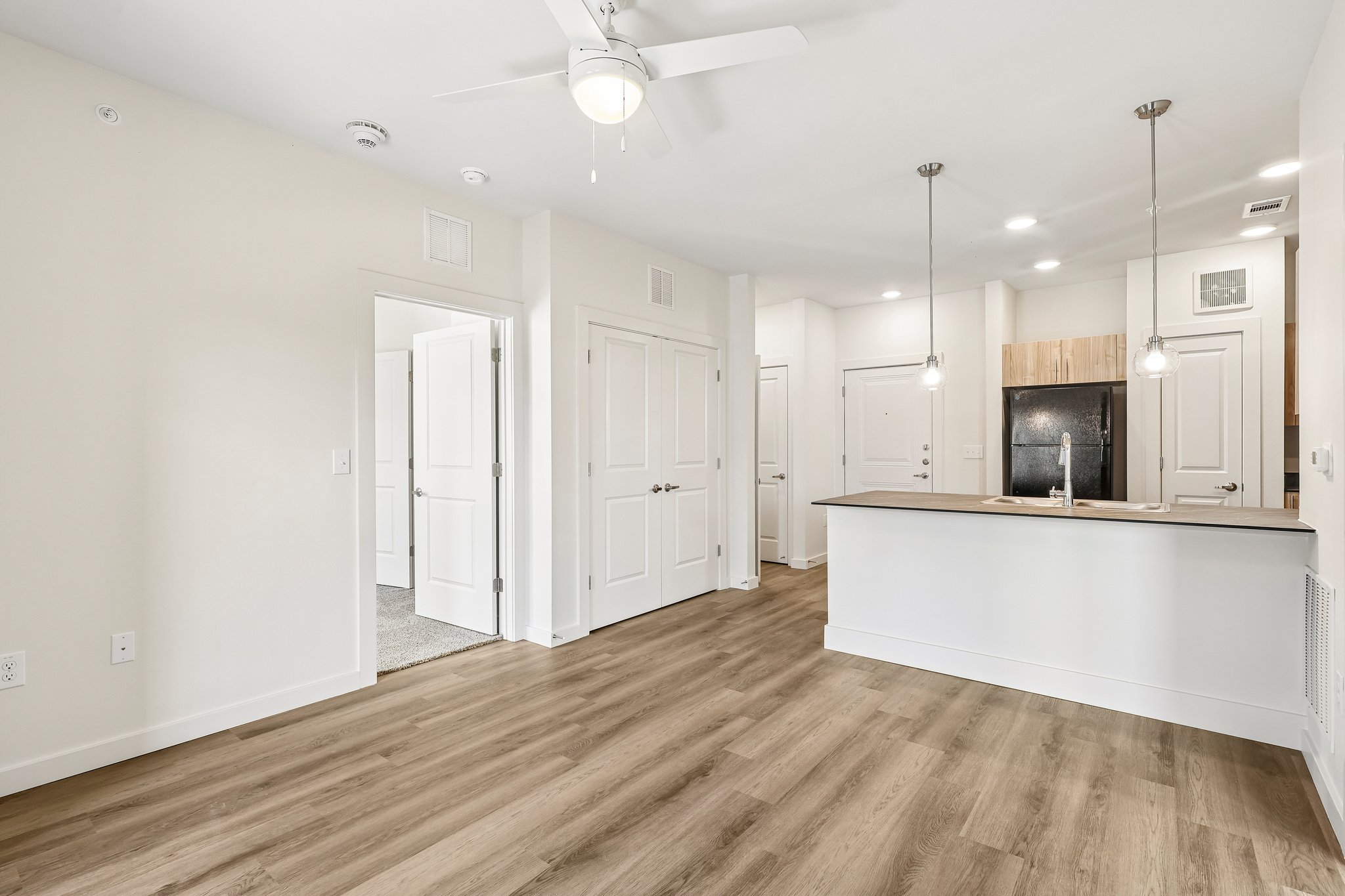 unfurnished living room with plank floors