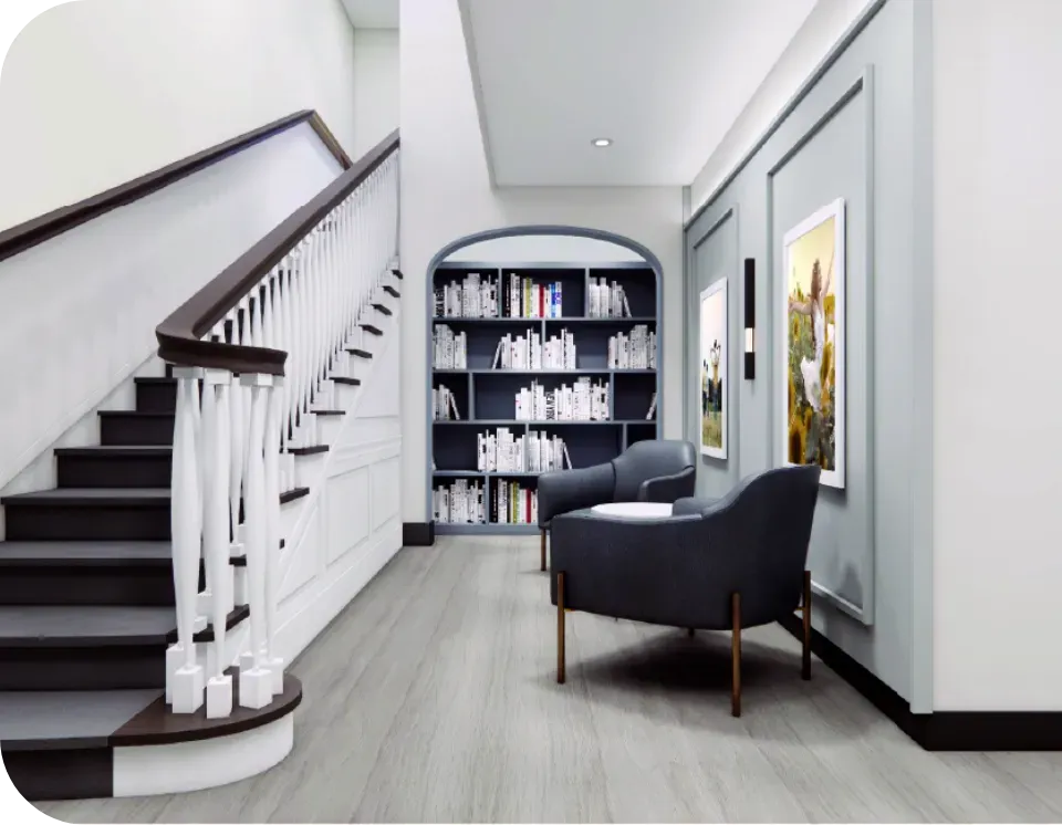 a chair sitting in a room next to a book shelf
