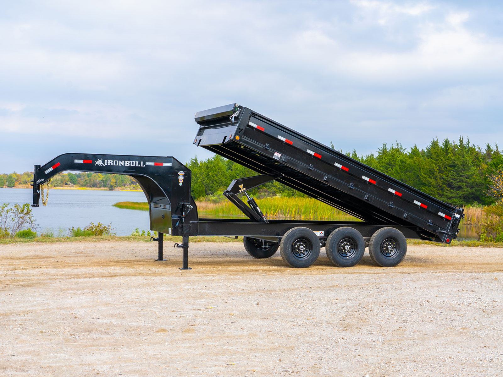 DDG gooseneck dump trailer bed lifted side view