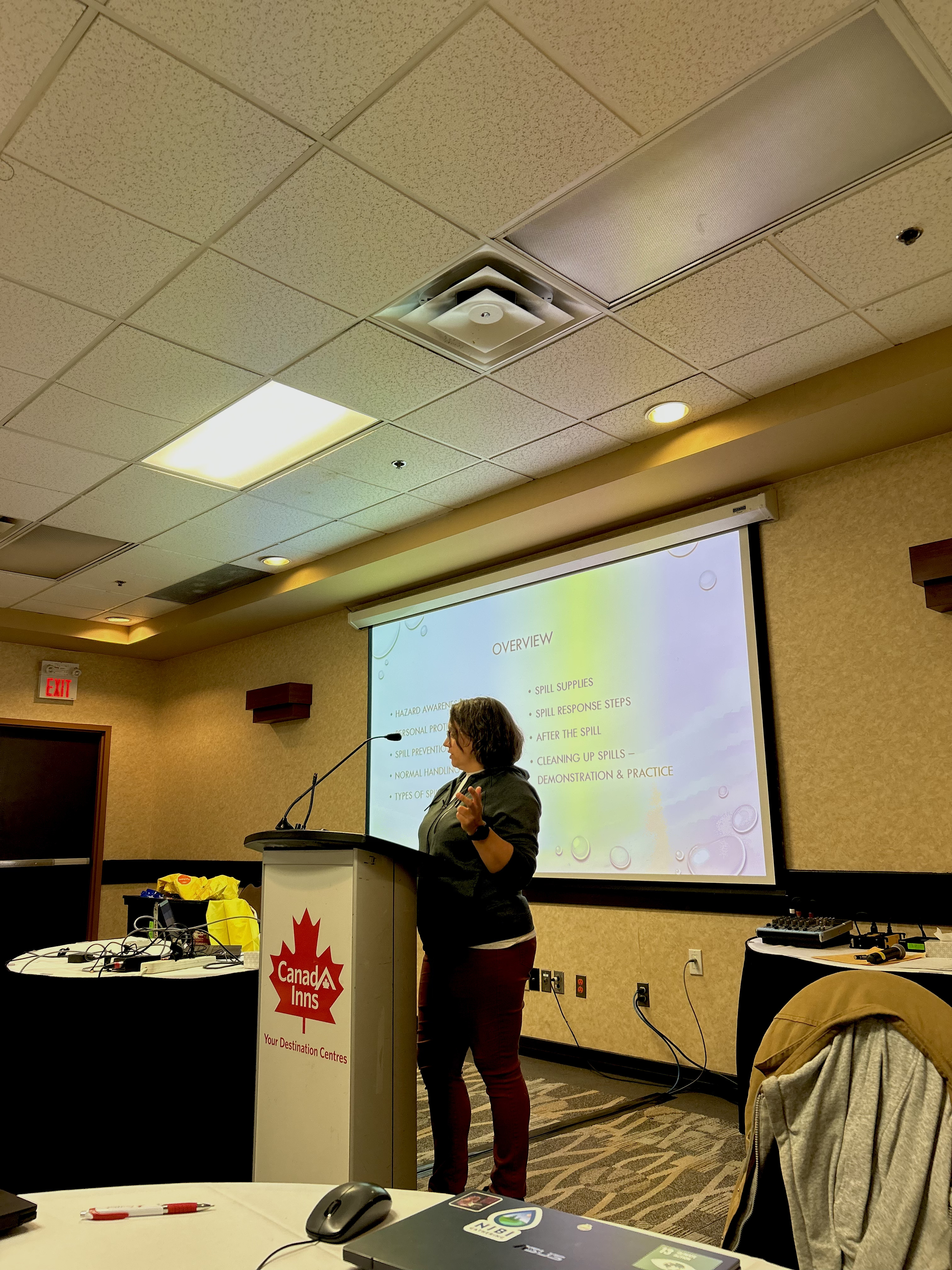 a speaker stands at a podium