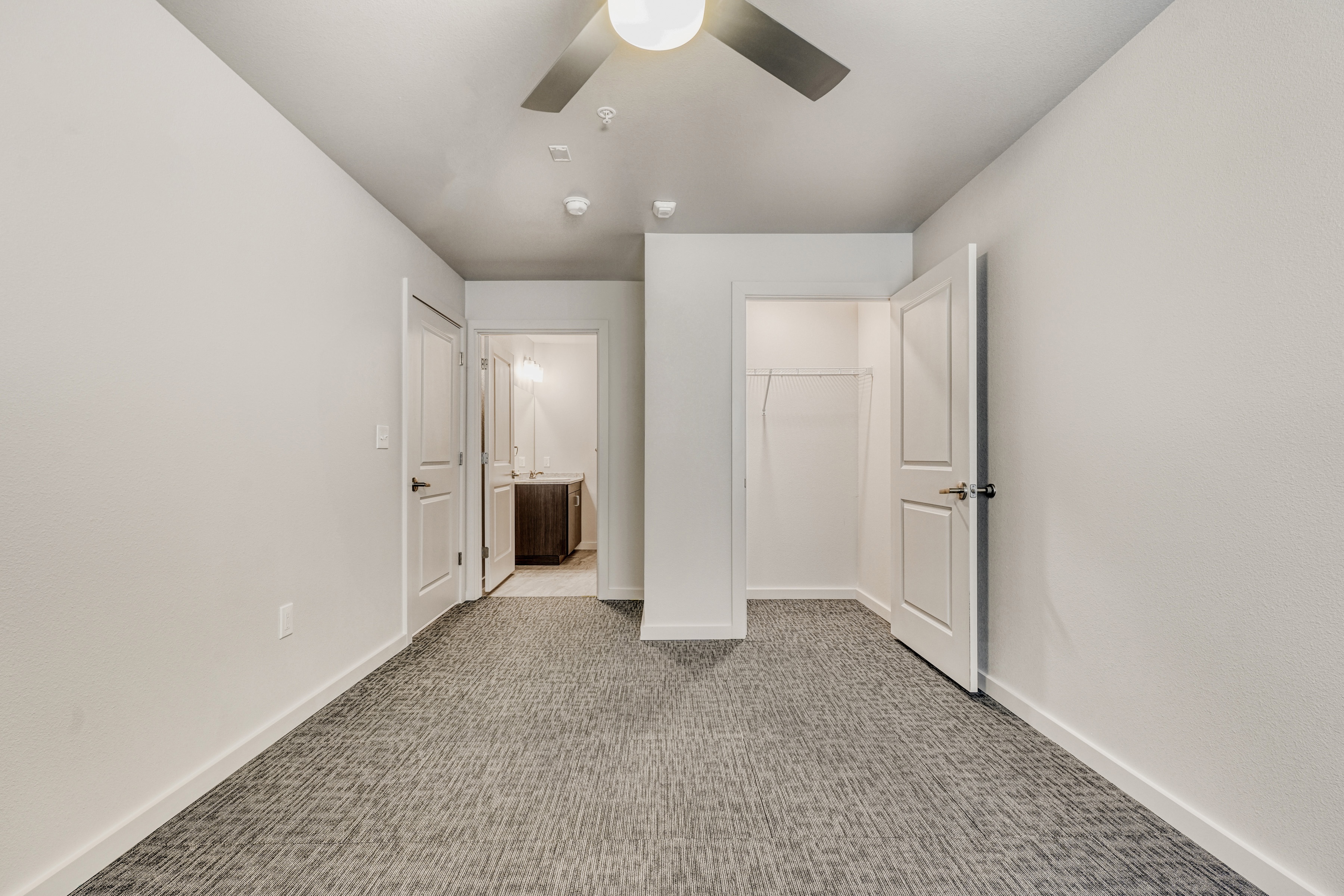 Empty bedroom with bathroom