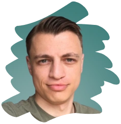 Portrait of a man with short dark hair wearing a green shirt against a teal abstract background.