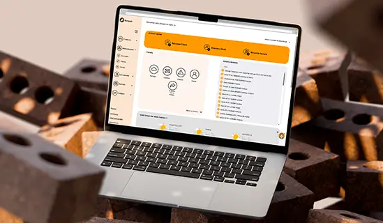 Batappli sur l'écran d'un ordinateur portable macbook posé sur des briques en terre cuite