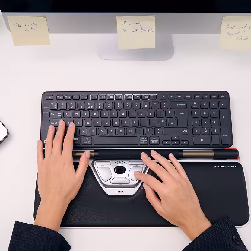 UK office worker using a centered RollerMouse to reduce mouse elbow strain