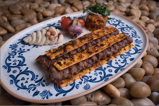 Adana Kebab served on a traditional Turkish plate
