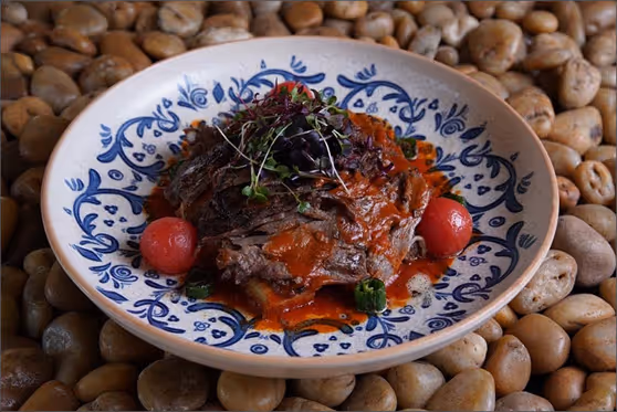 Iskender Kebab served on a traditional Turkish plate