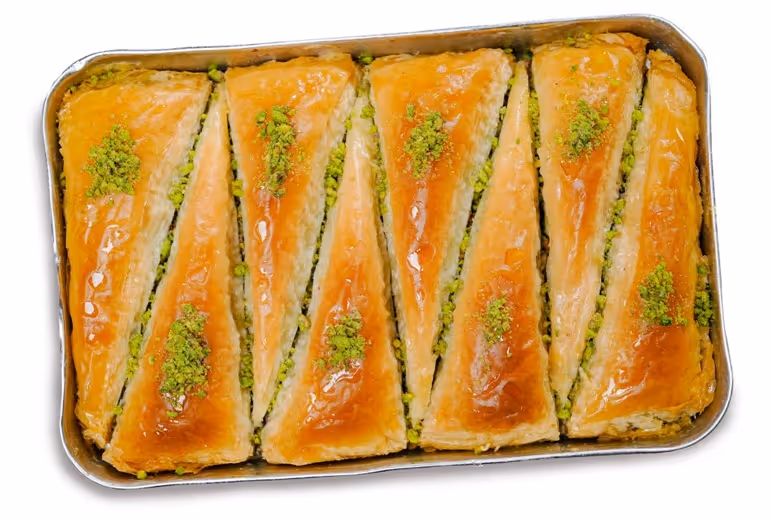 Traditional Turkish baklava dessert served fresh at Turkish Village in Dubai, perfect sweet ending to a romantic dinner