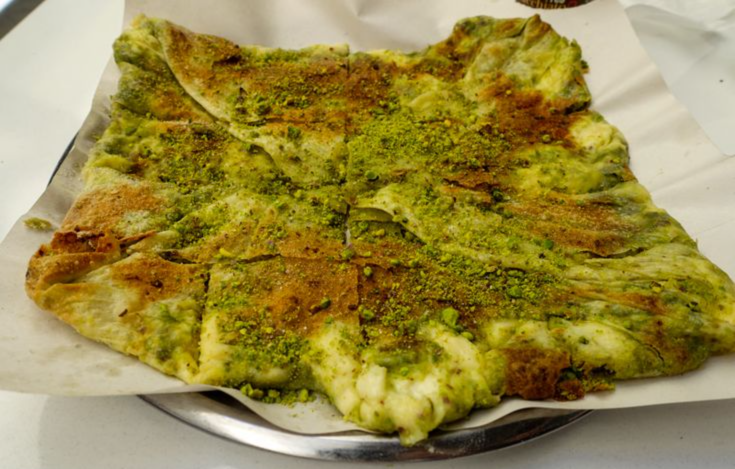 Antep-style katmer, a square of thin folded pastry filled with clotted cream and generously topped with crushed pistachios