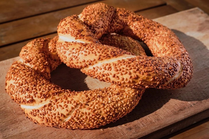 Close-up of a Turkish simit, a ring-shaped bread coated in sesame seeds