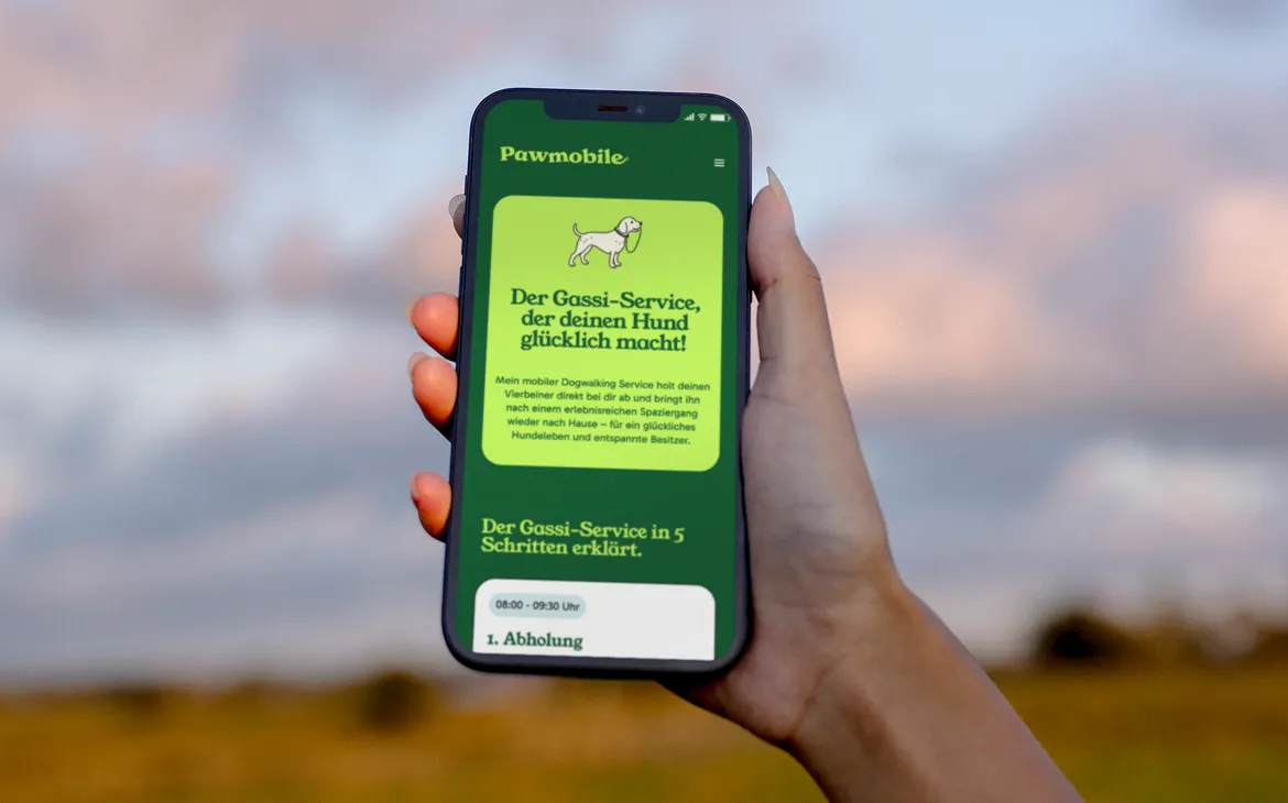 A Phone in a womans hand showing a website.
