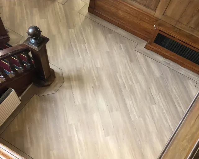 A picture of a wooden floor in a house.