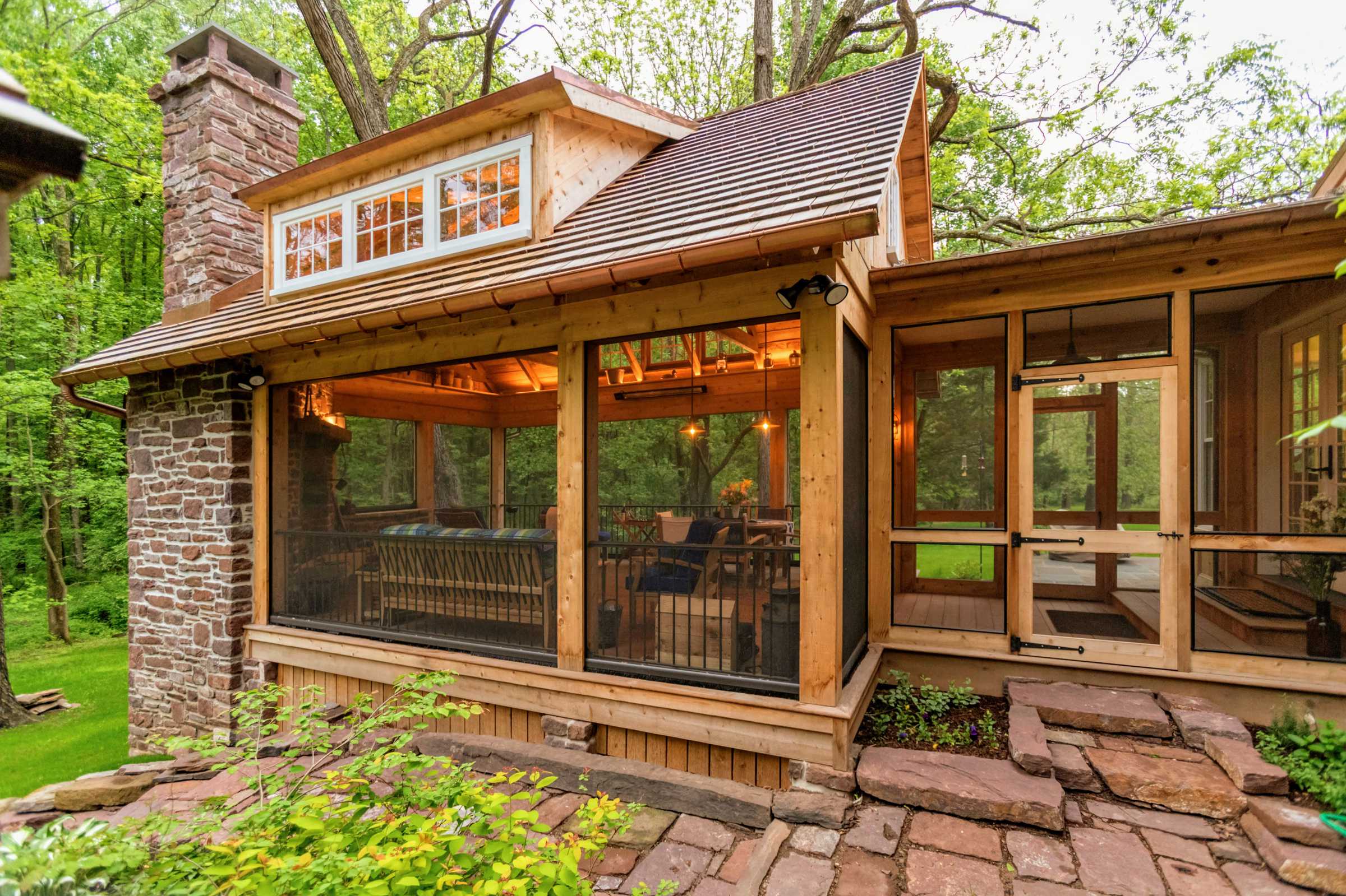 Timber frame outdoor living room with large fireplace.