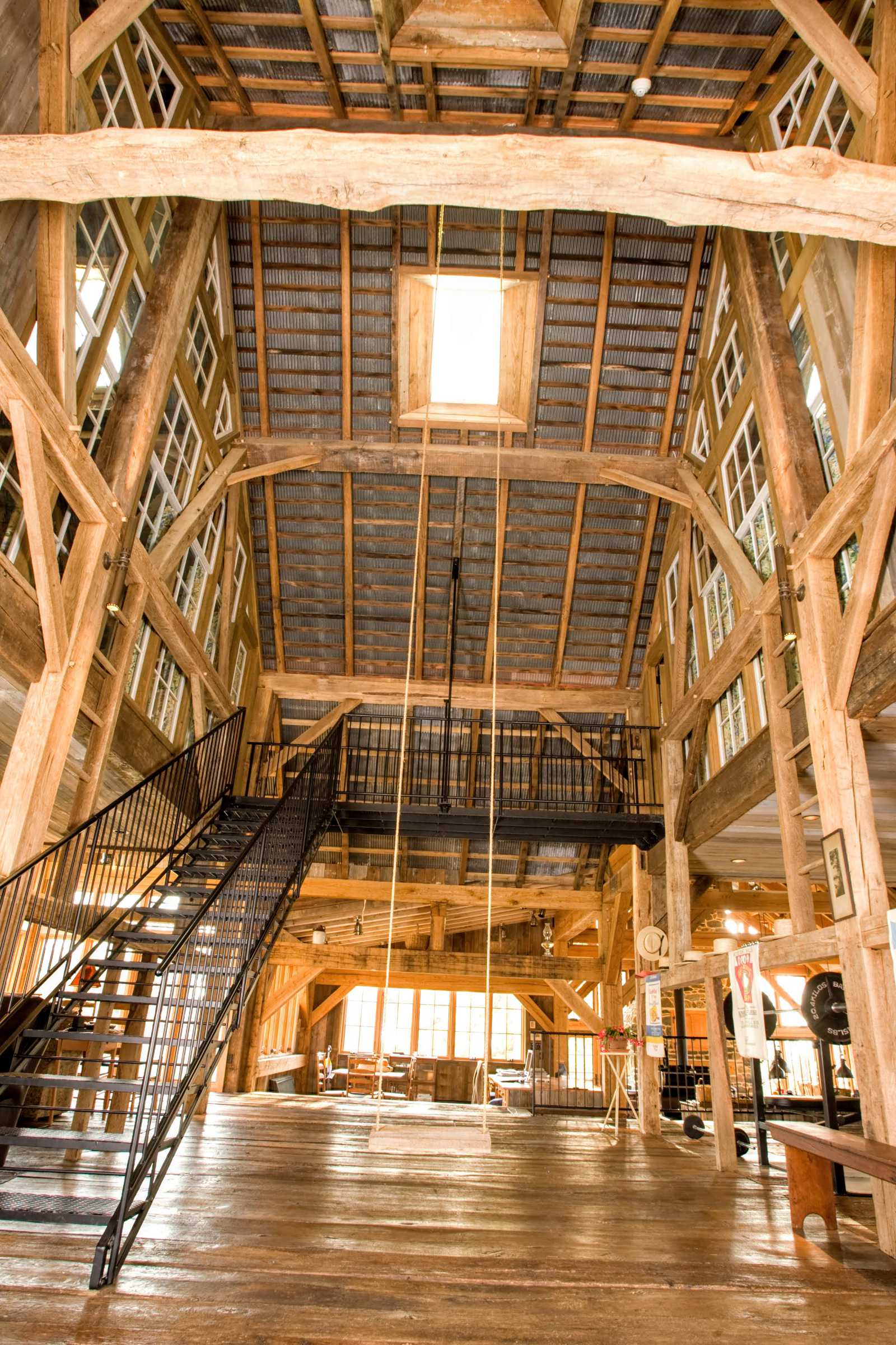 Restored timber frame barn converted to an entrance foyer.