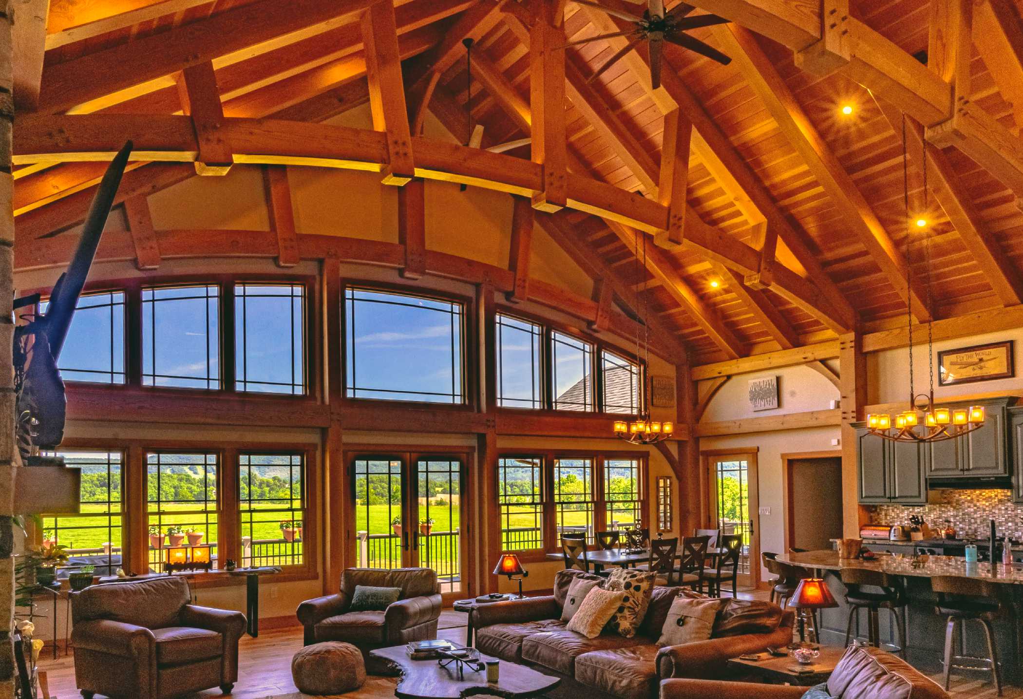 Timber frame living room with huge windows and an expansive view.