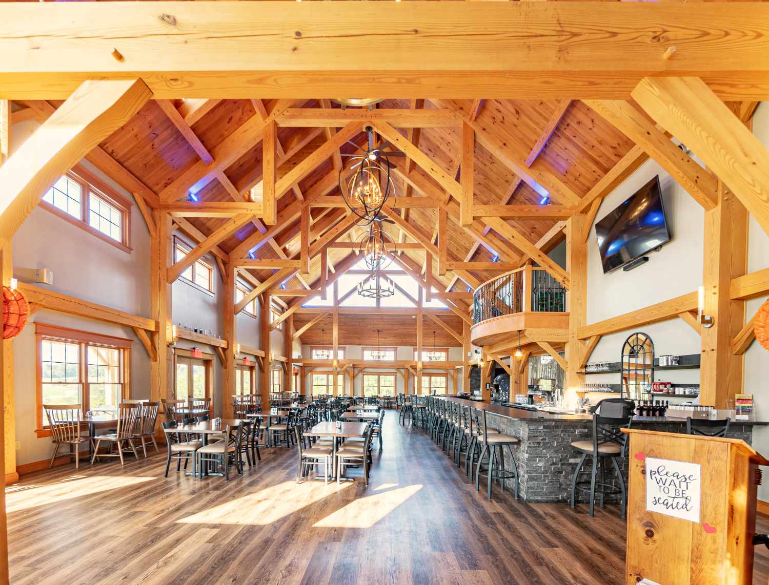 Huge interior and vaulted ceiling of timber frame restaurant.