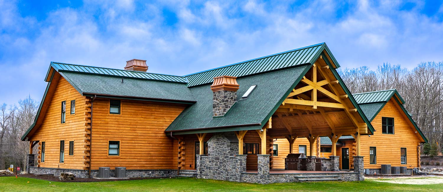 Expansive timber frame pavilion with outdoor kitchen