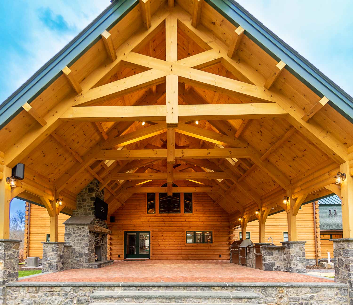 Unique pavilion with timber frame trusses, fireplace and outdoor kitchen