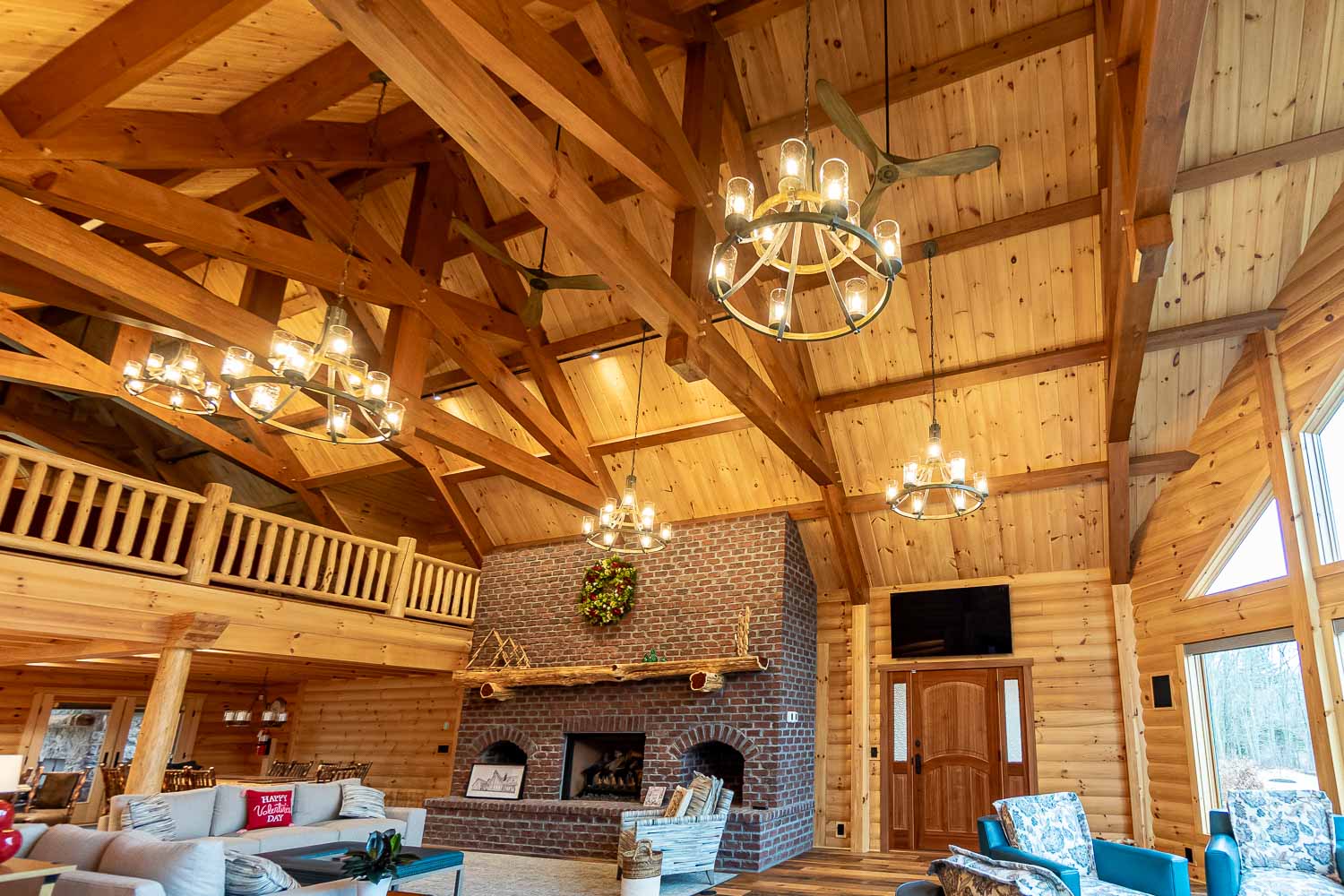 Large great room with fireplace and red cedar mantle