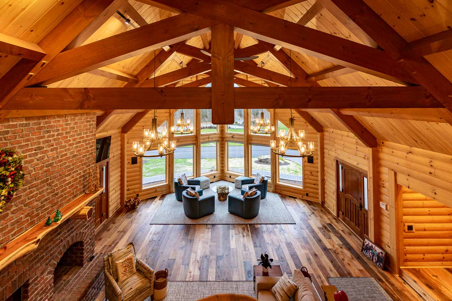 Perfect view from loft, overlooking great room and a close up of the timber frame trusses