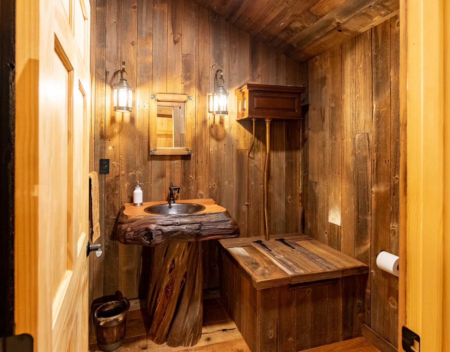 Outhouse style powder room with real wood sink.