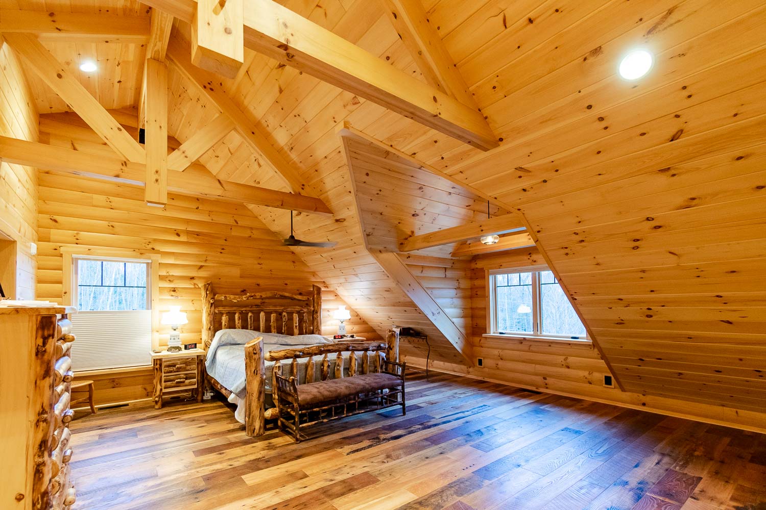 Large and spacious bedroom with timber frame trusses