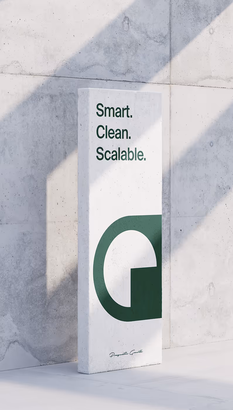 Vertical white sign leaning against a concrete wall with green text reading 'Smart. Clean. Scalable.' and a large stylized green letter 'G'.