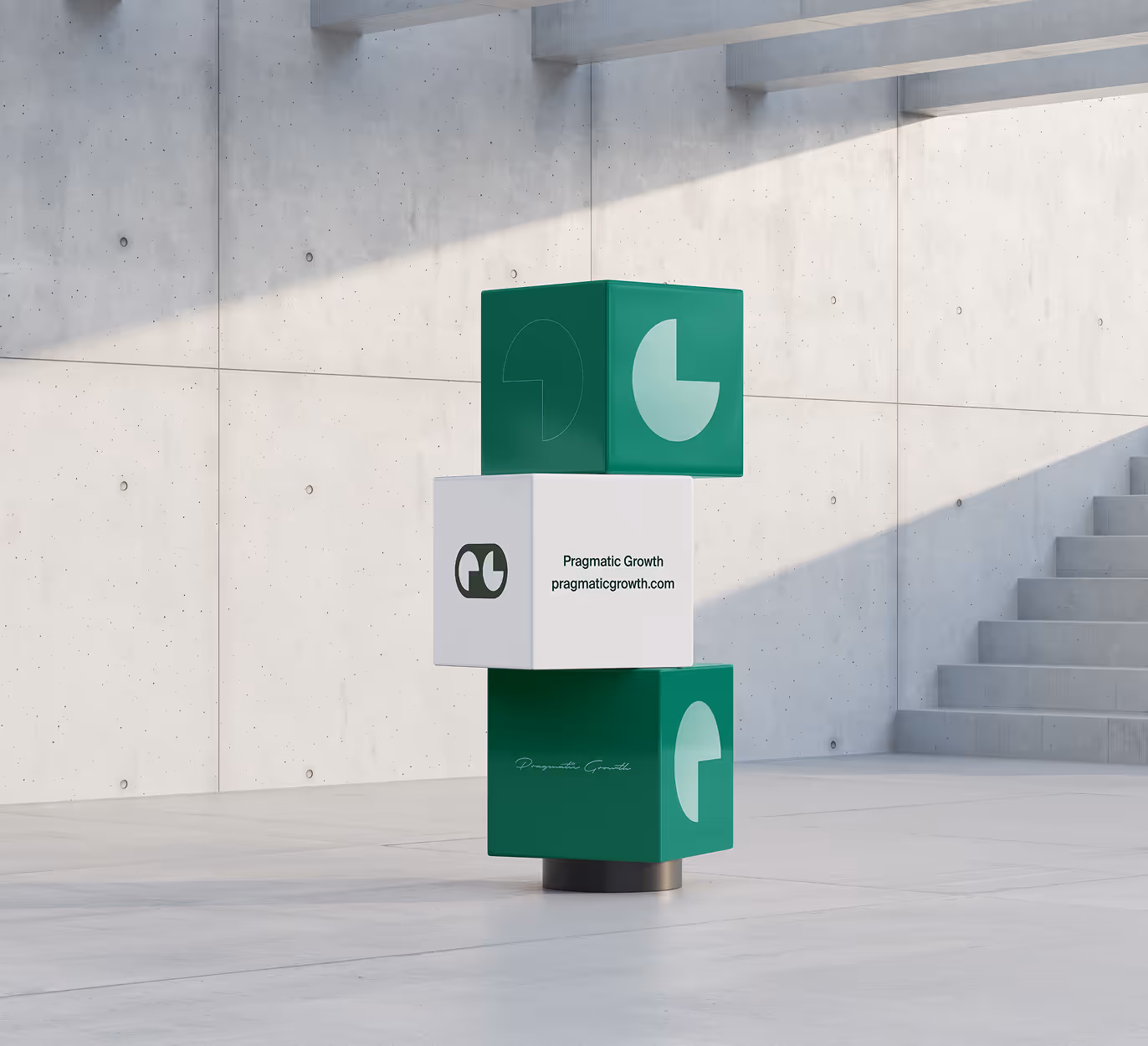 Three stacked cubes with Pragmatic Growth branding in a minimal concrete space with stairs.