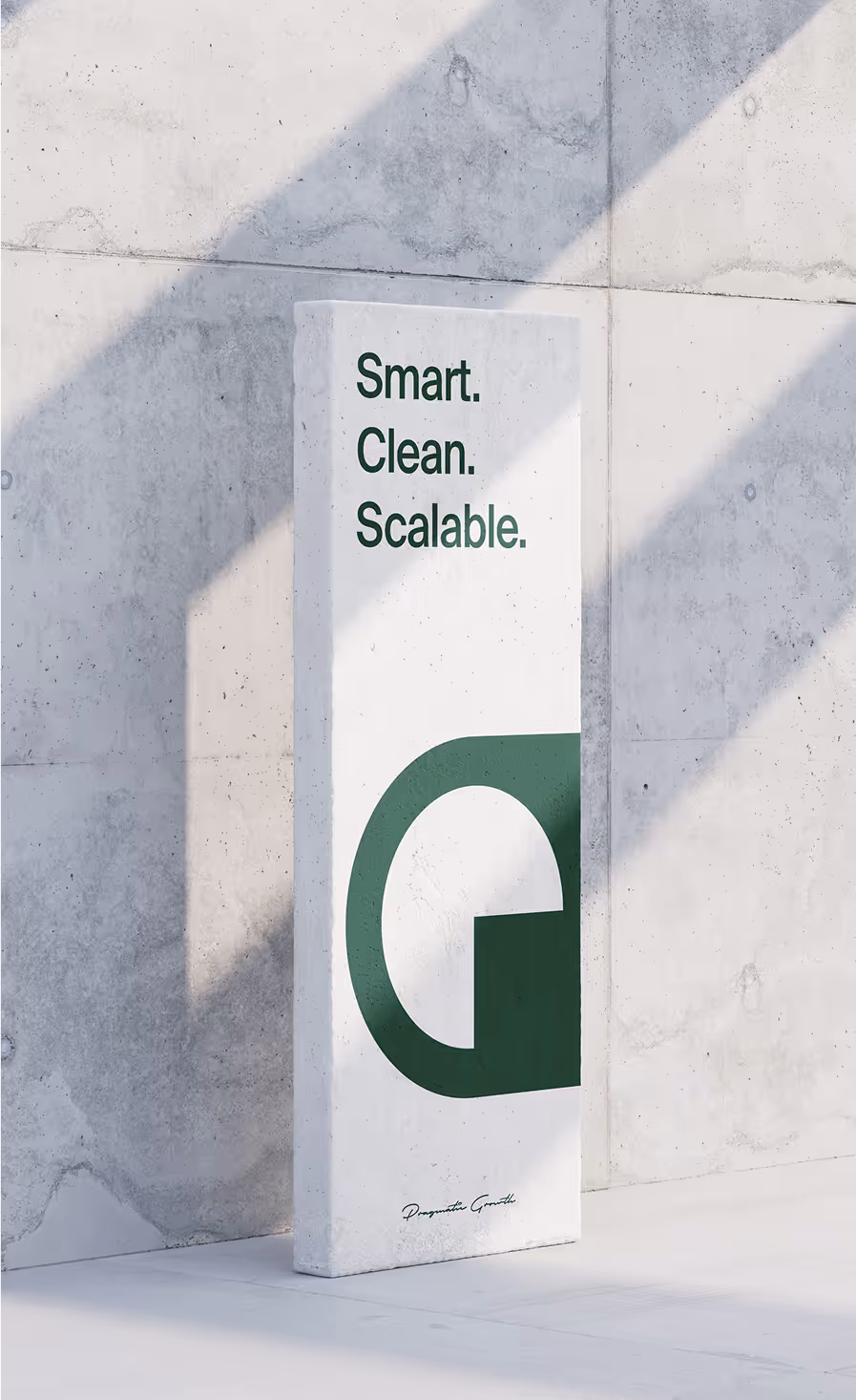 White vertical sign with green text 'Smart. Clean. Scalable.' and a large stylized 'G' against a concrete wall with angled shadows.