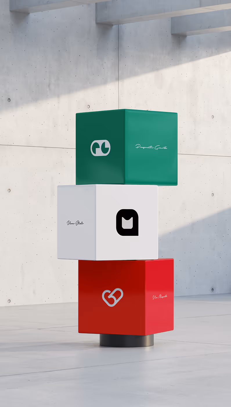 Three stacked cubes in an industrial-style room: green with a white logo and text, white with a black logo and text, and red with a white logo and text.