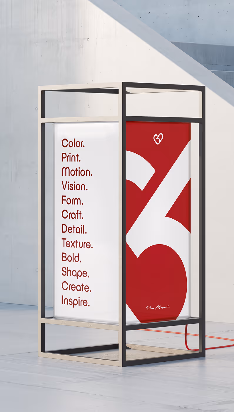 Modern rectangular display stand with a white panel listing creative words and a red panel featuring a large stylized number 26.