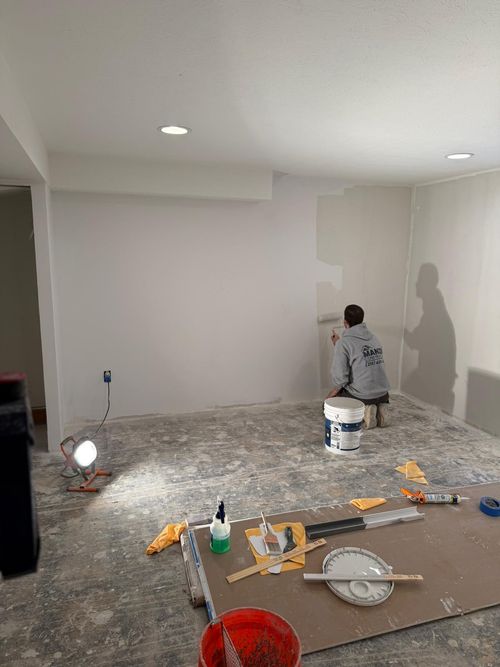 Before — basement stripped to studs in Pepper Pike, OH — Manzil