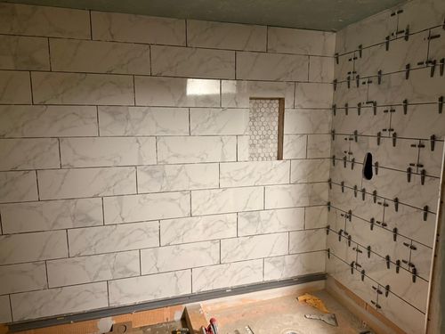 Before — exposed concrete block foundation wall in Pepper Pike, OH — Manzil