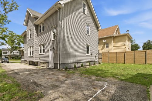 Before — house exterior prior to renovation — Manzil