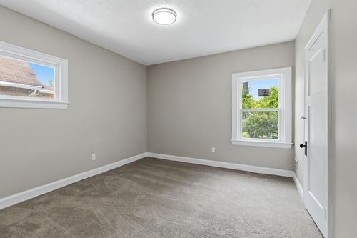 After — finished bedroom with new flooring and paint — Manzil