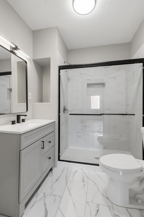 After — remodeled bathroom after full renovation — Manzil