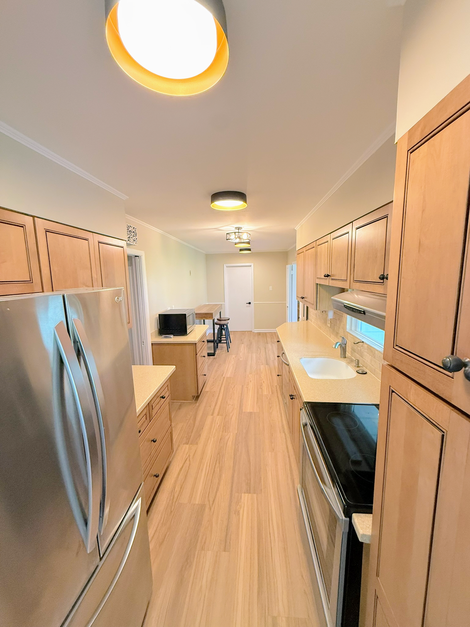 Updated living space with new flooring, paint and lighting in a Cleveland ranch