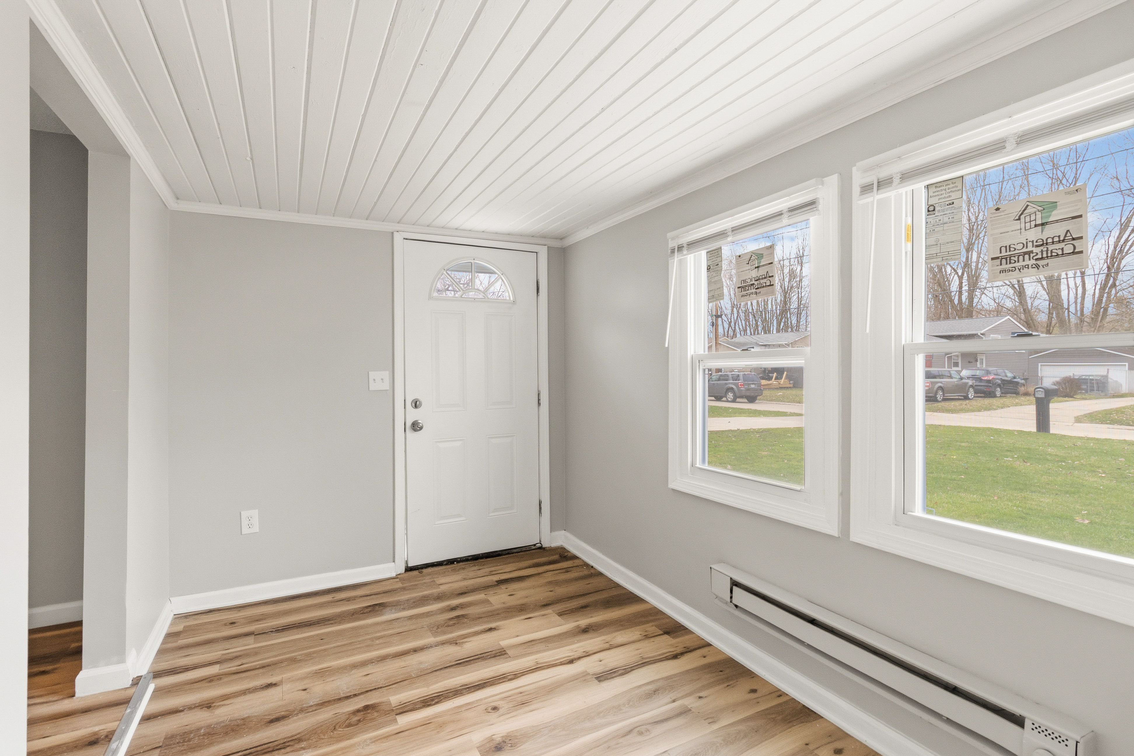 After — sunroom entry with natural light in North Ridgeville, OH — Manzil Renovation