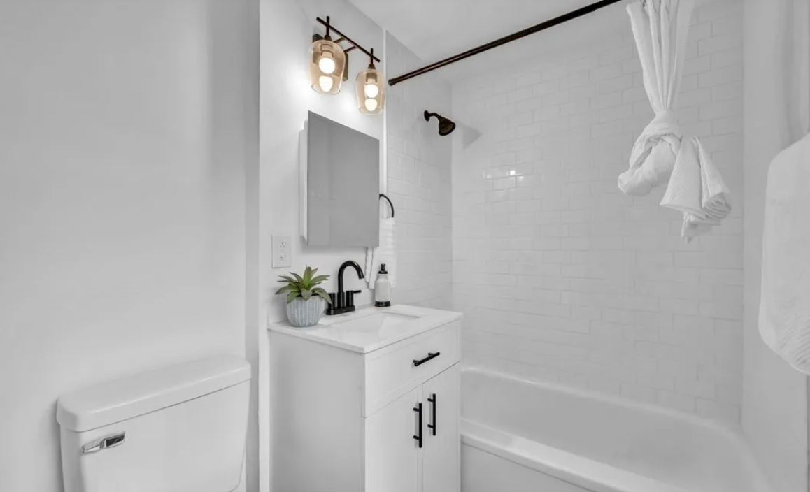 After — clean modern second bathroom in Brecksville, OH — Manzil Renovation