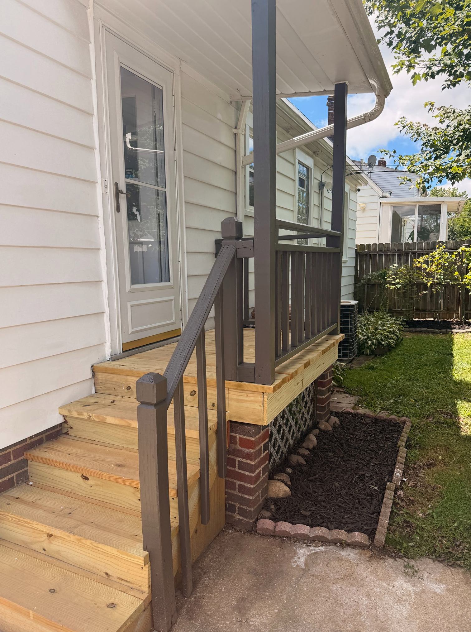 Close-up of new boards and railing on the rebuilt rear deck, Wayland Ave Cleveland renovation