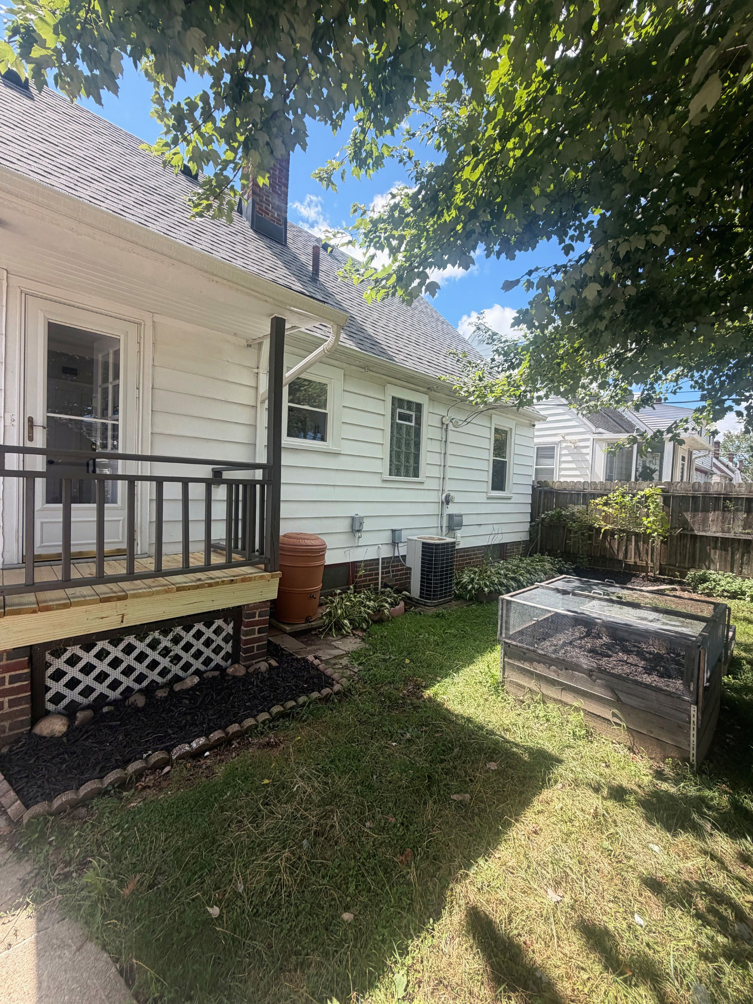 Side yard with refreshed landscaping, Wayland Ave Cleveland renovation