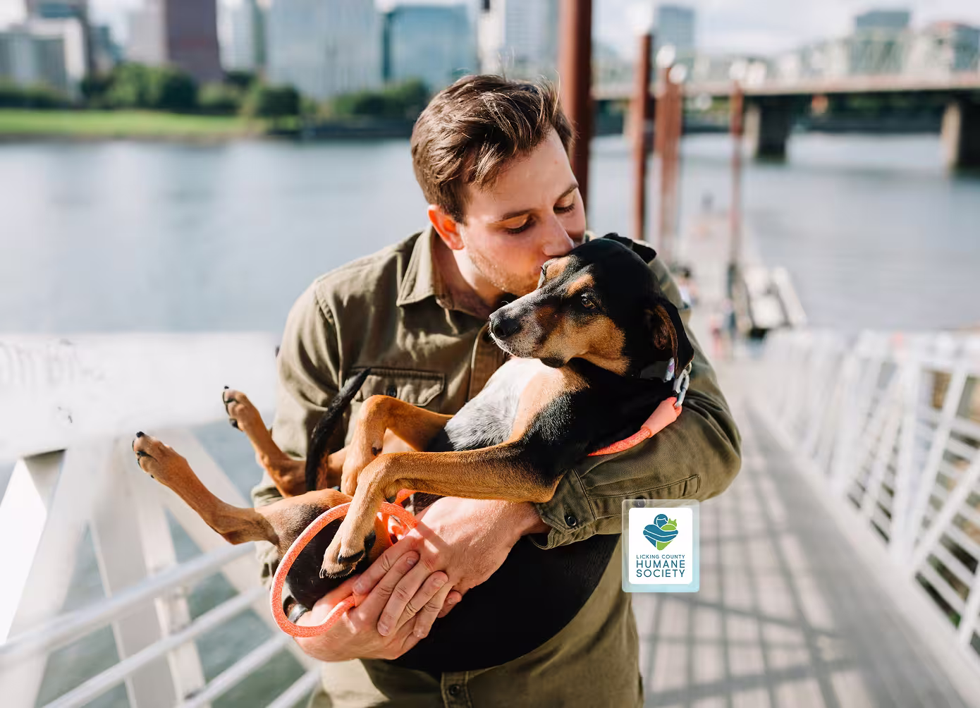 Man hugging a dog