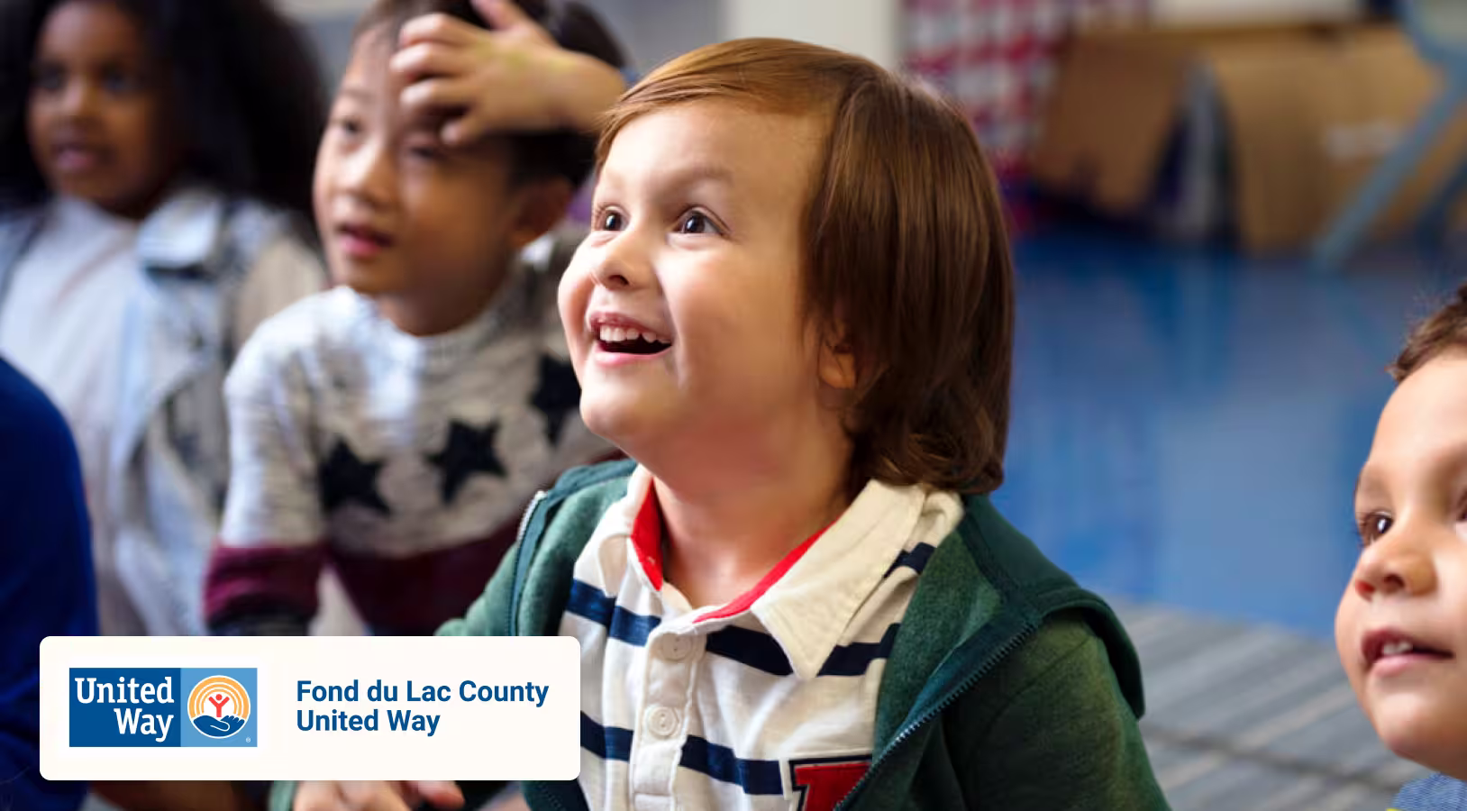 Child smiling up at someone