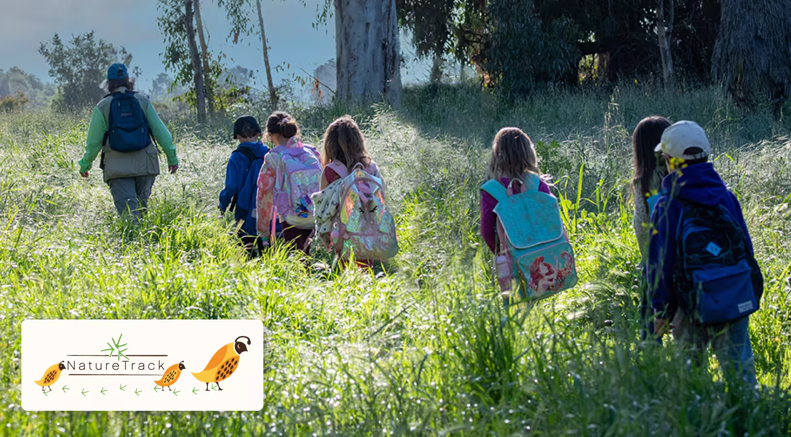 Group of people hiking through a field