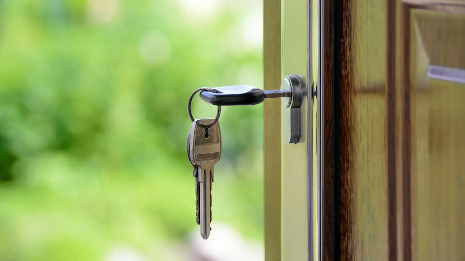 Keys left in an open house door.