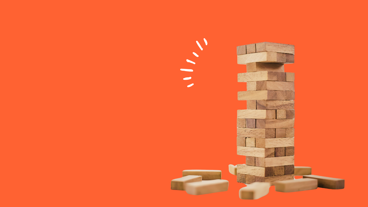 jenga tower on orange background